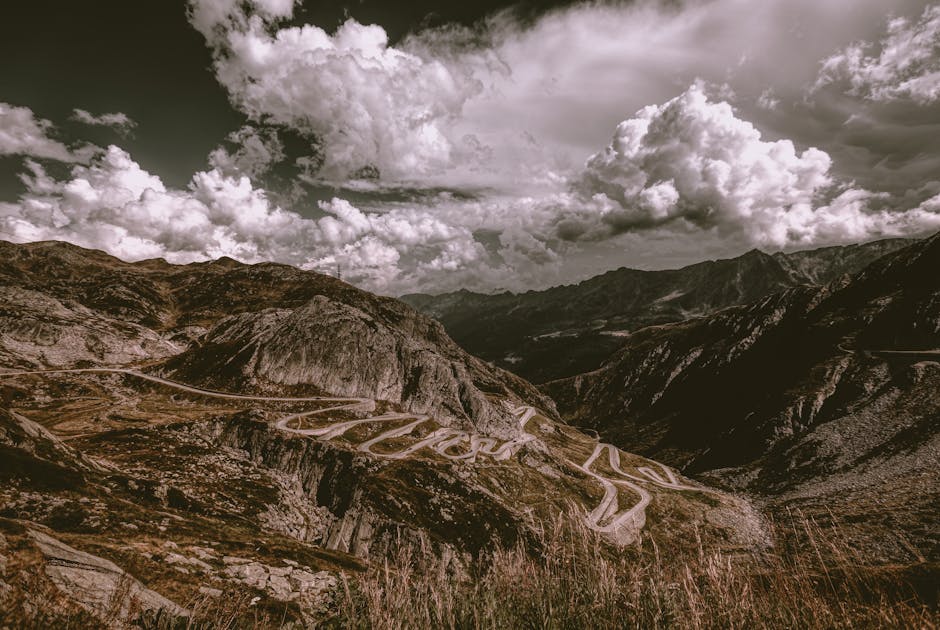 Breathtaking landscape of winding roads through the Swiss Alps at Gotthard Pass.