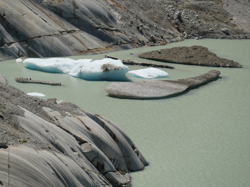 A serene view of melting glacier ice floes at Furka Pass, Switzerland, showcasing natural beauty.